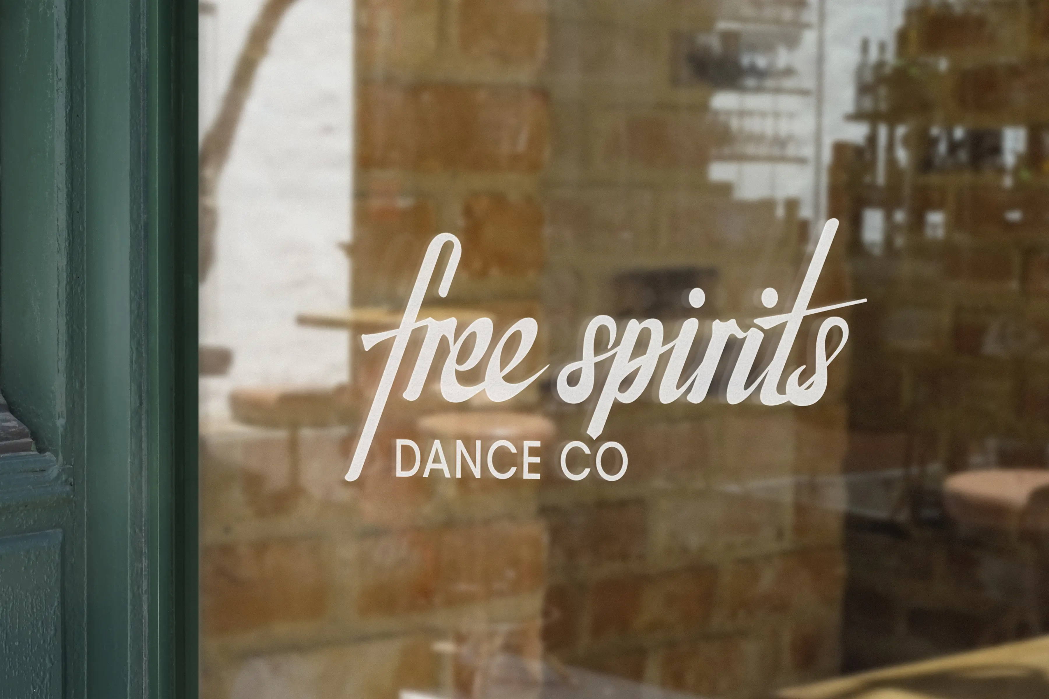 Mockup of the final logotype on a window.